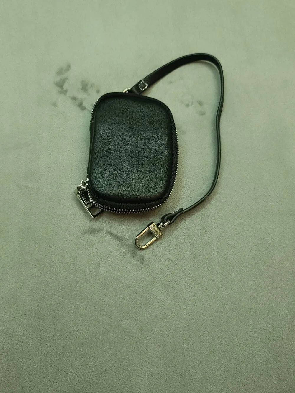 Authentic Steve Madden black textured faux leather mini zip-around pouch